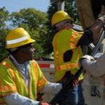 Electrical company lineworkers working