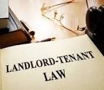 Landlord-tenant law on an office table. stock photo