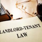 Landlord-tenant law on an office table. stock photo