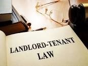 Landlord-tenant law on an office table. stock photo