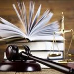 Scales of justice, gavel and law book stock photo